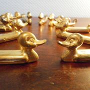 Box of 12 knife holders in silver metal, shape of canrds, 60s