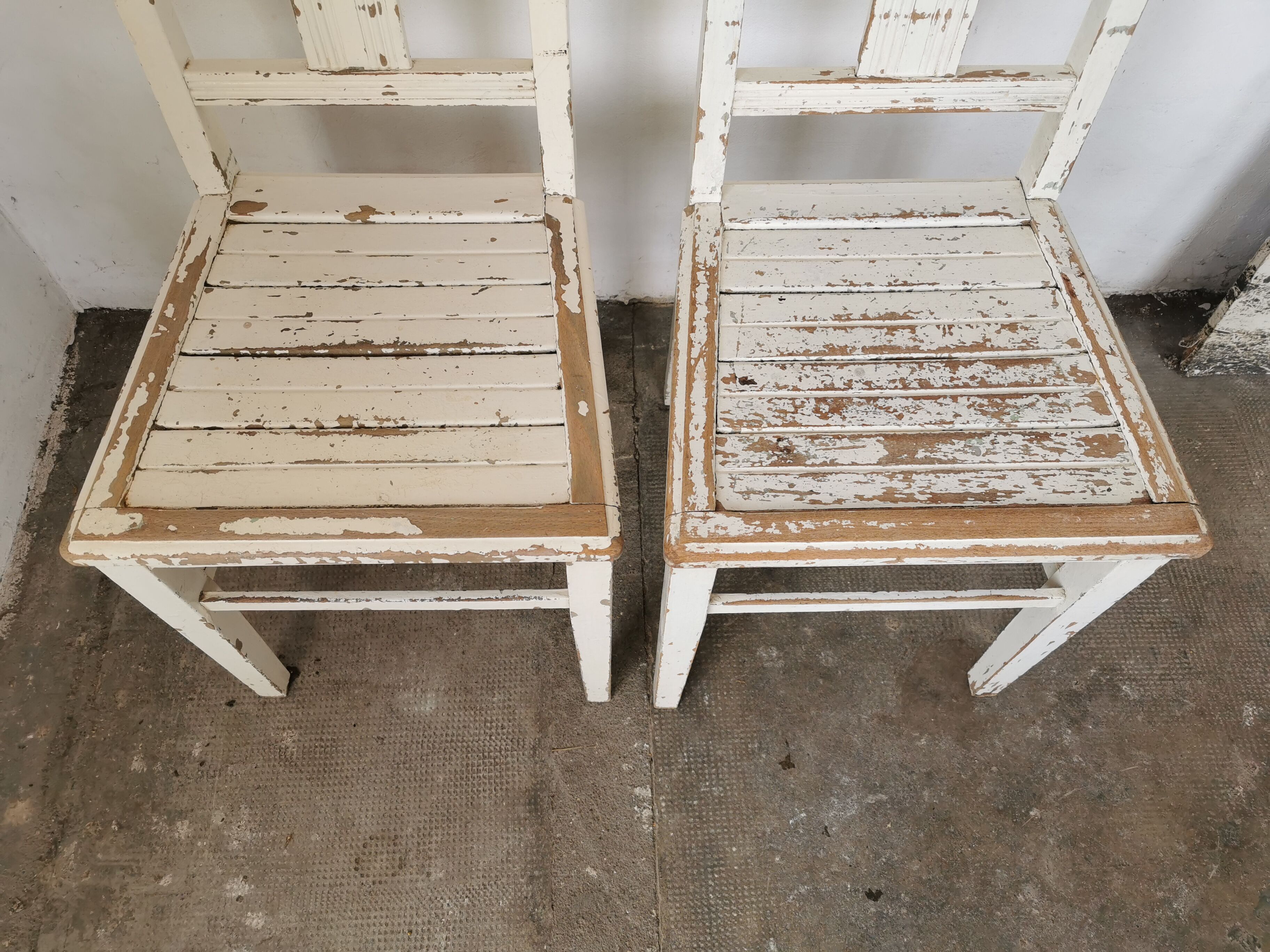 Set of 6 mismatched white chairs