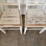 Set of 6 mismatched white chairs