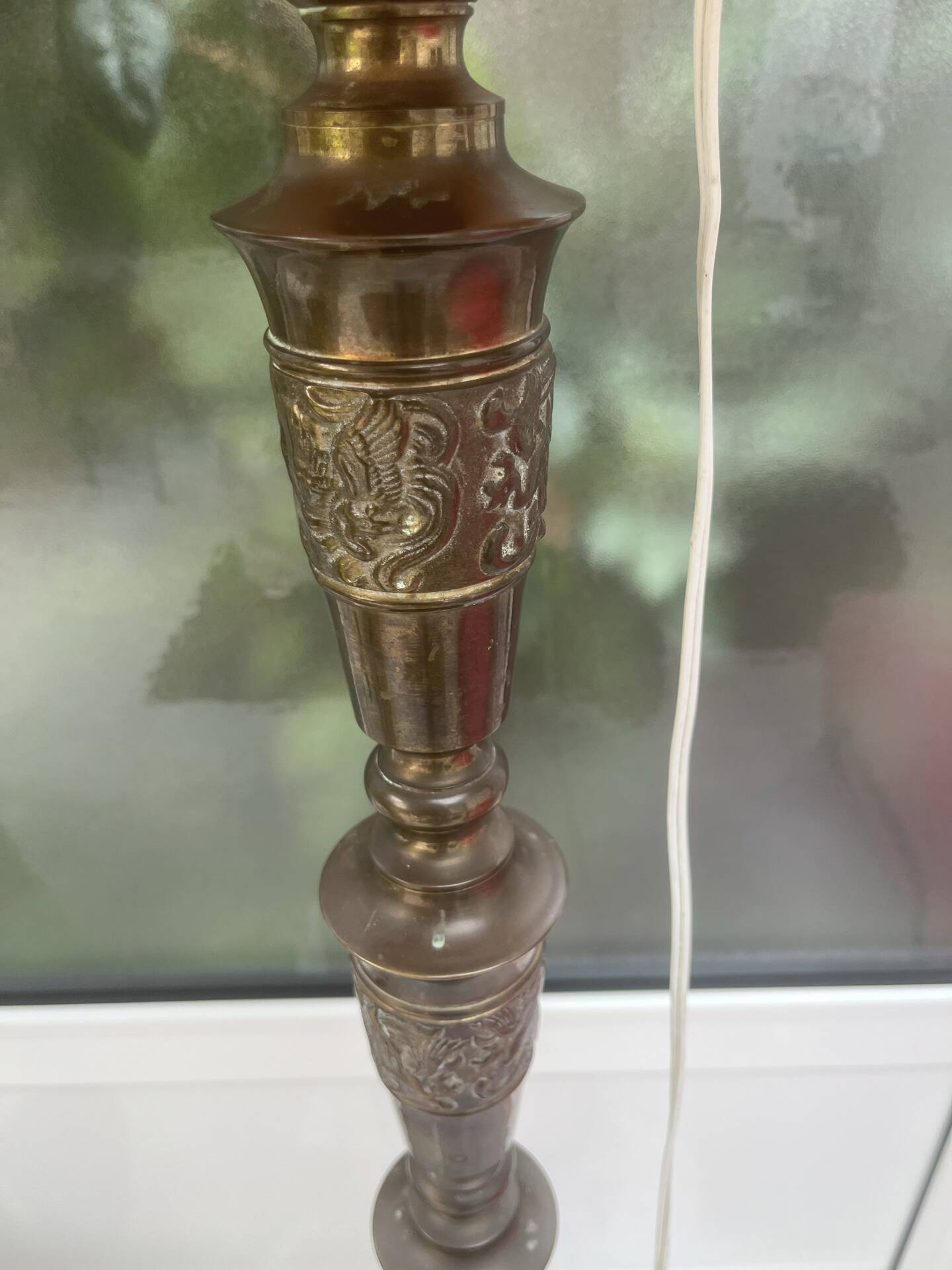 Brass floor lamp with an Orientalist wooden base.