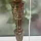 Brass floor lamp with an Orientalist wooden base.