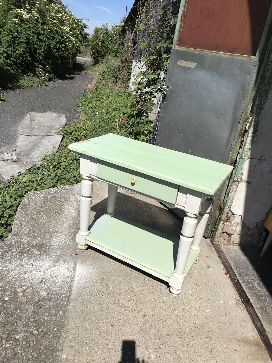 Rustic wooden dining table painted white and pale green, with a central drawer, 1950s.