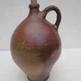 ancient water jug in vitrified sandstone, bulging avc handle