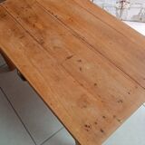 Coffee table with raw wood and a large drawer.