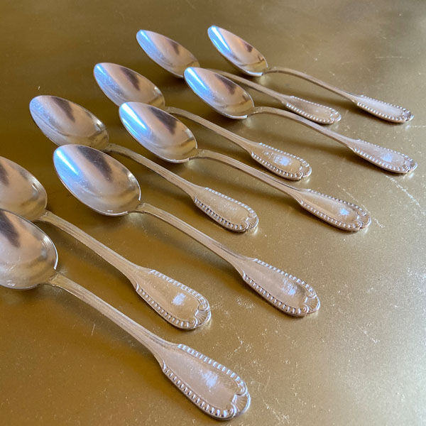 Series of 9 silver metal dessert spoons, Boulenger