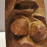 Ceramic relief portraying a lady. Emerging out of the background.