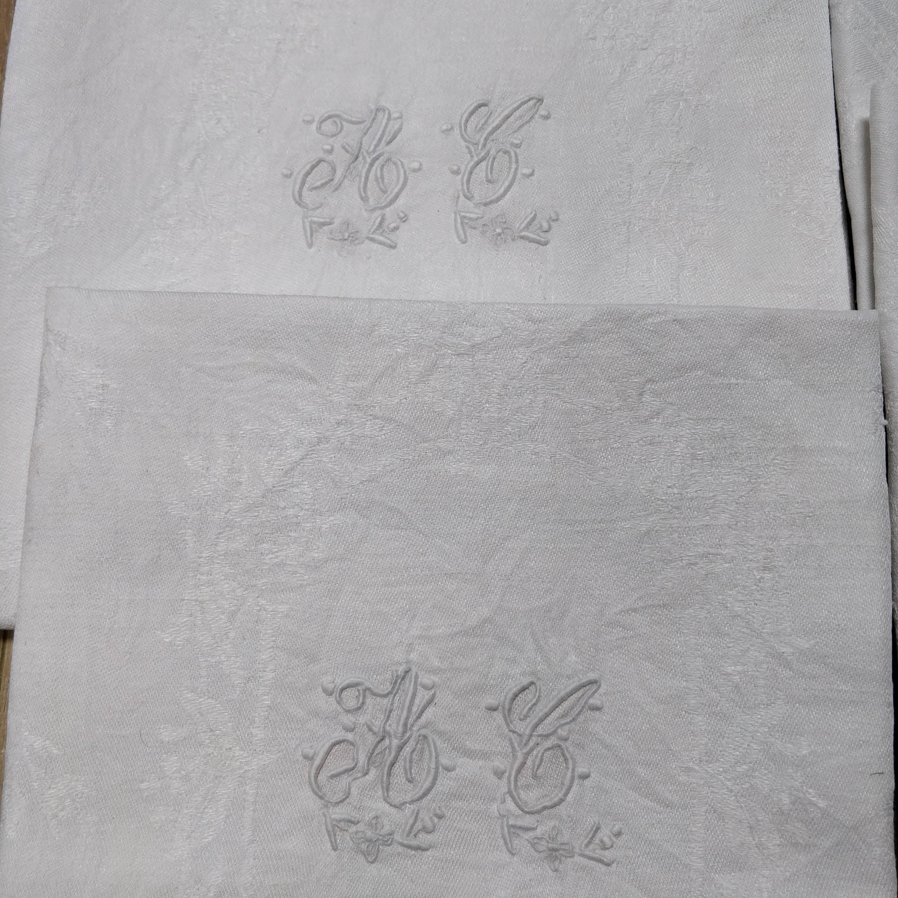White linen towels embroidered