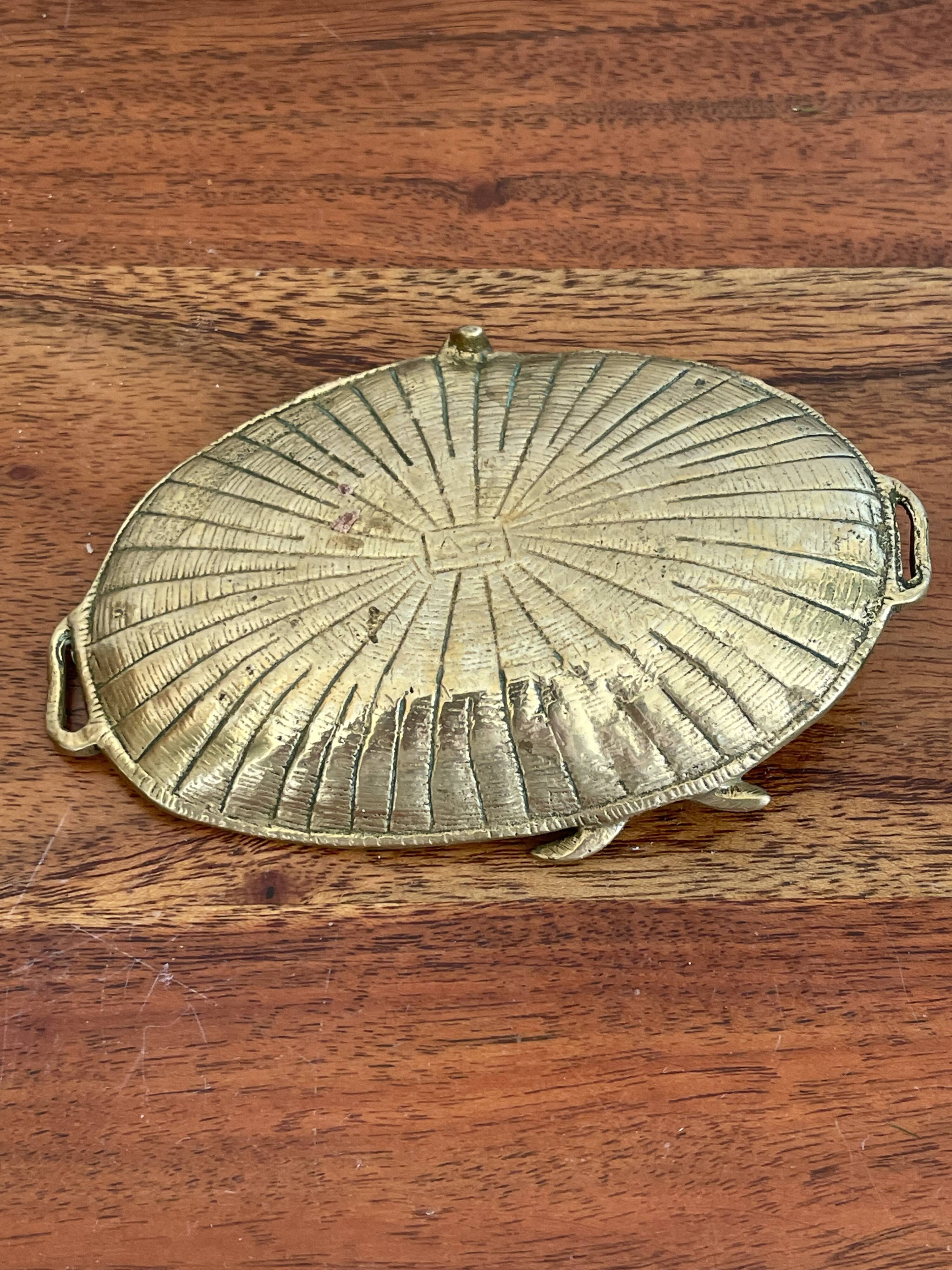 Empty brass snail pocket