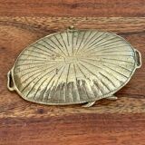 Empty brass snail pocket