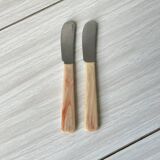 Pink bakelite butter knives.