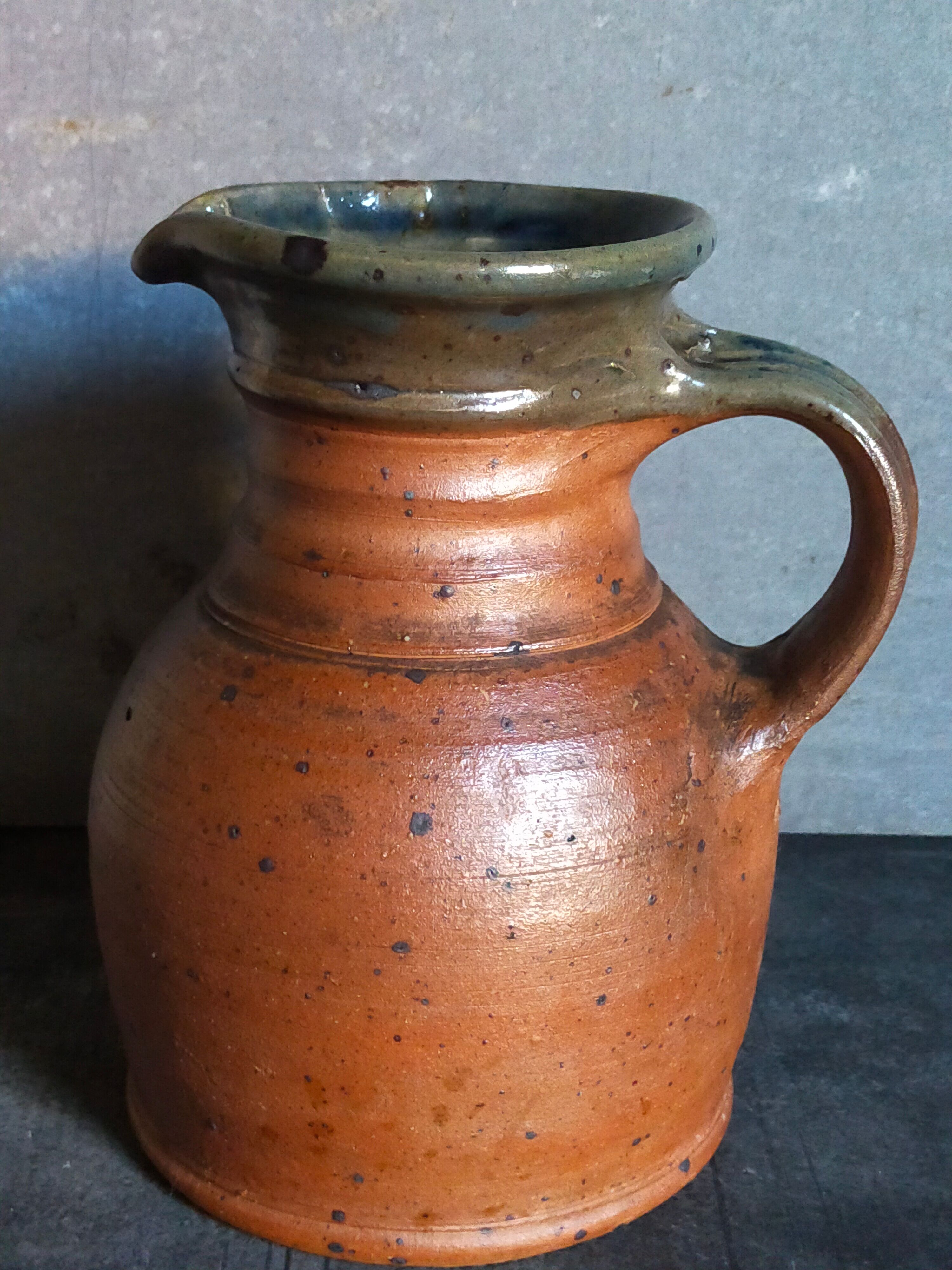 Pitcher traditional pottery Folk art in old enamelled sandstone