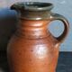Pitcher traditional pottery Folk art in old enamelled sandstone