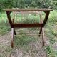 Magazine rack with wooden and gilded brass tablet