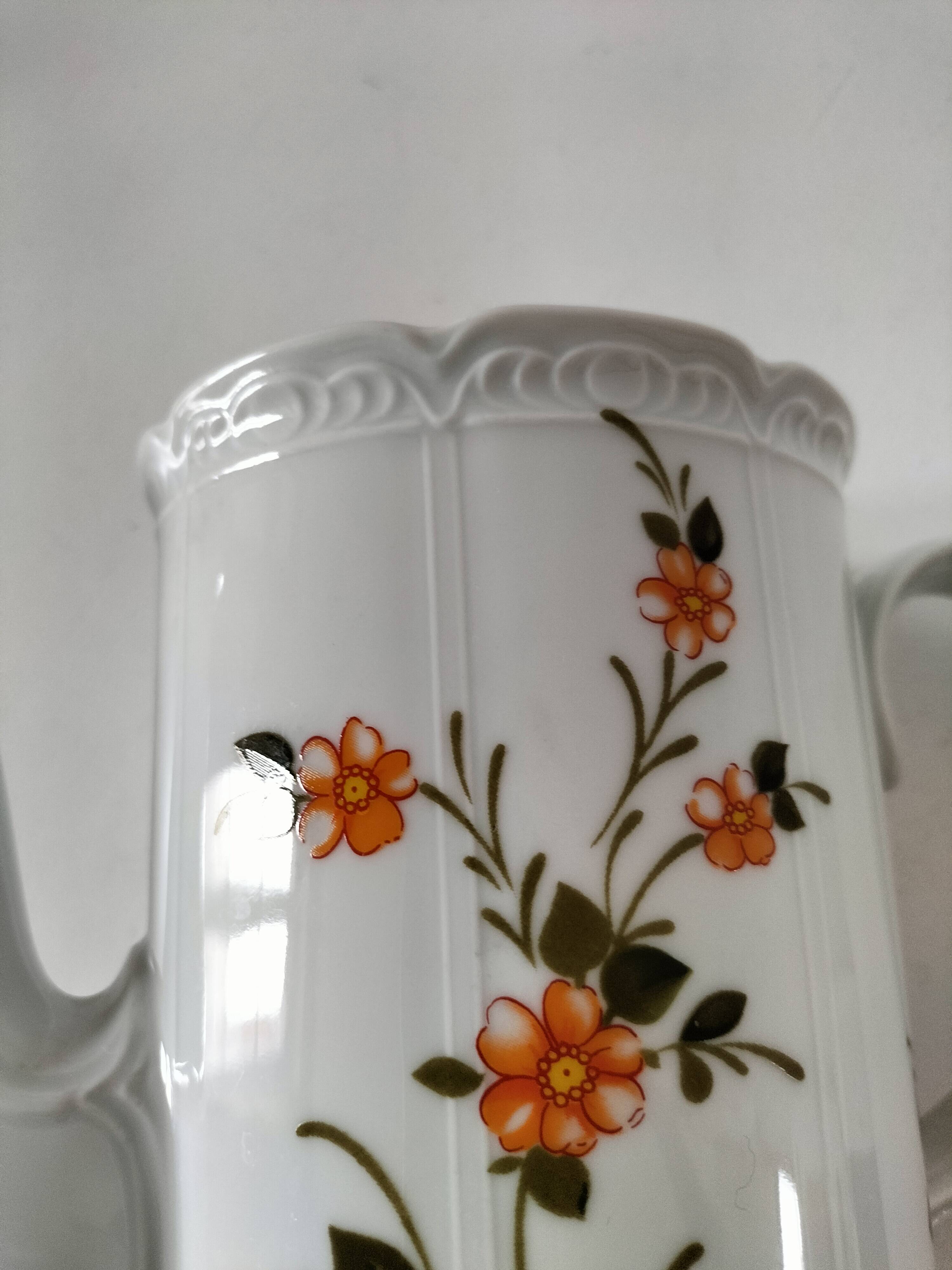 Vintage coffee pot Winterling Bavaria with orange floral decoration.