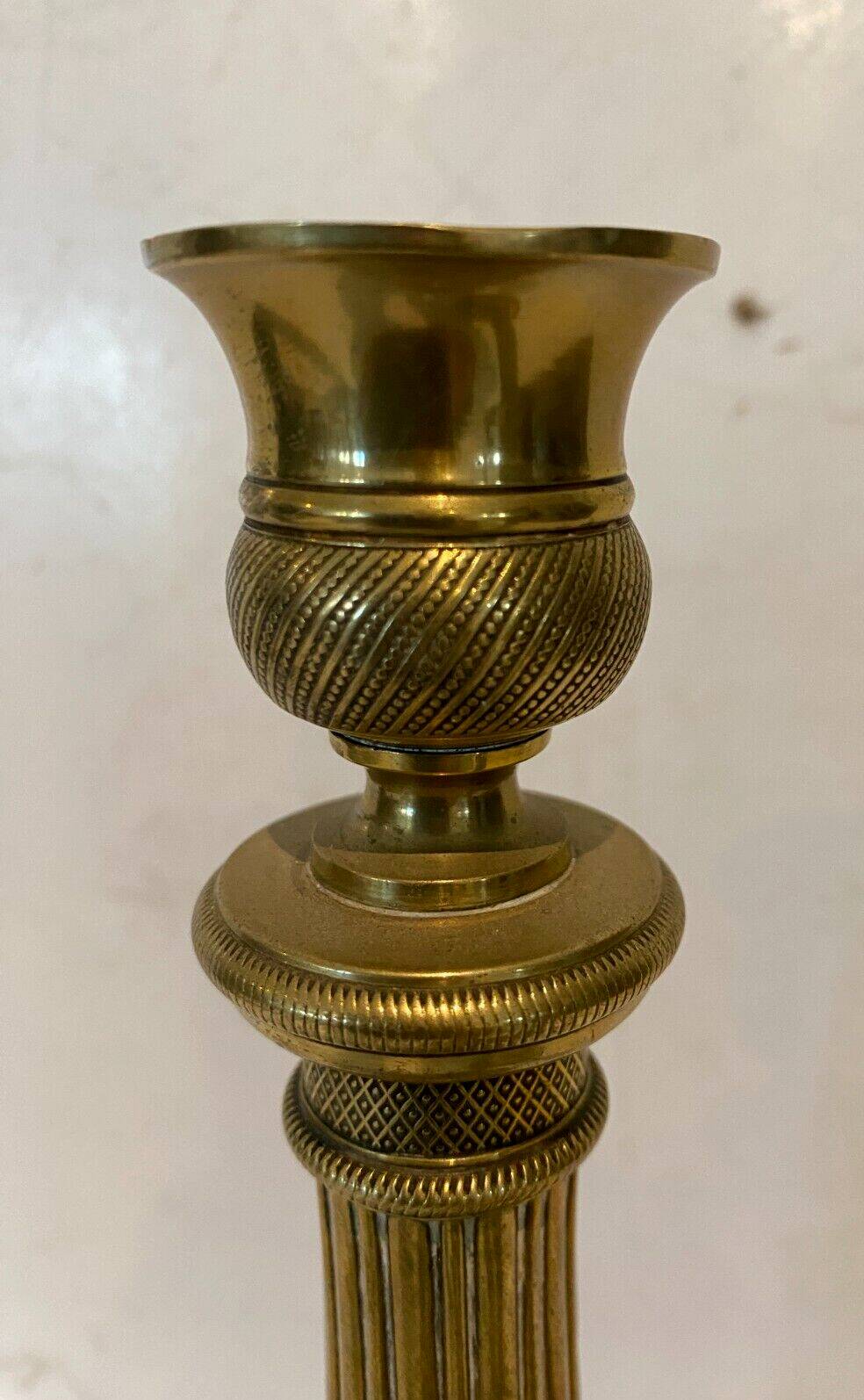 Pair of Louis XVI style candlesticks in 19th century chiseled bronze