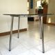Table ronde design 1970 en verre et métal