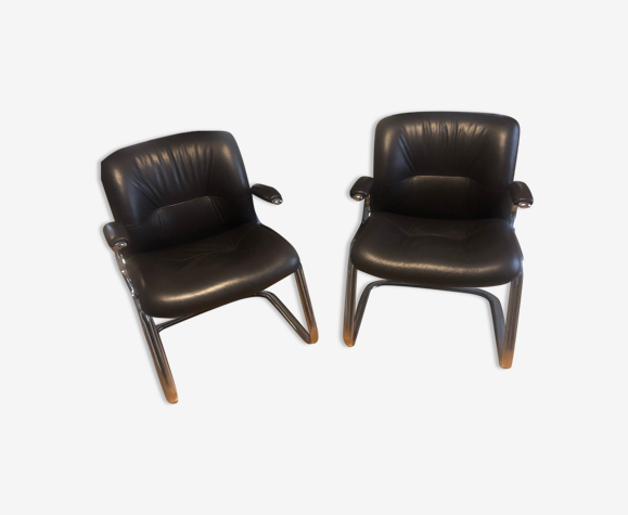 Pair of leather armchairs in 70s style