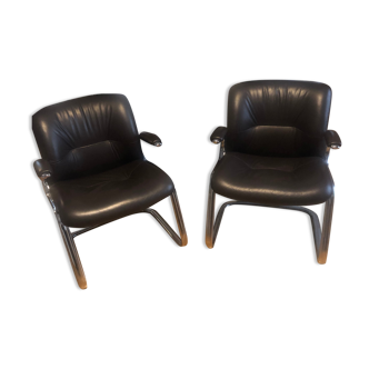 Pair of leather armchairs in 70s style