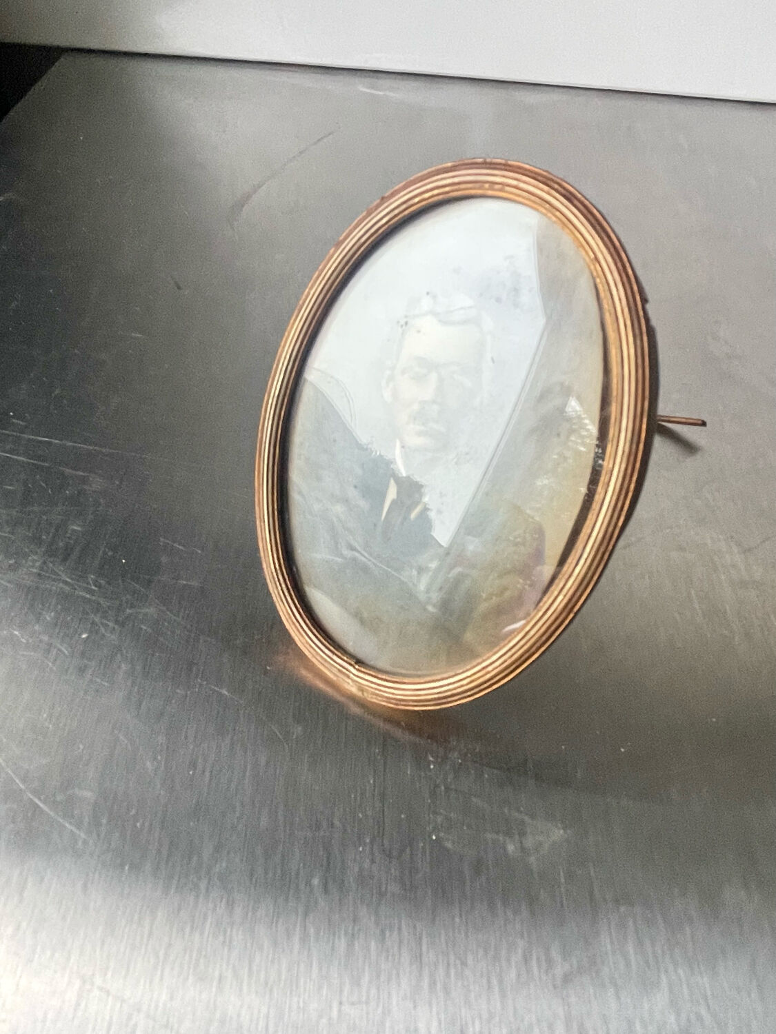 Metal gold colored oval picture frame brass