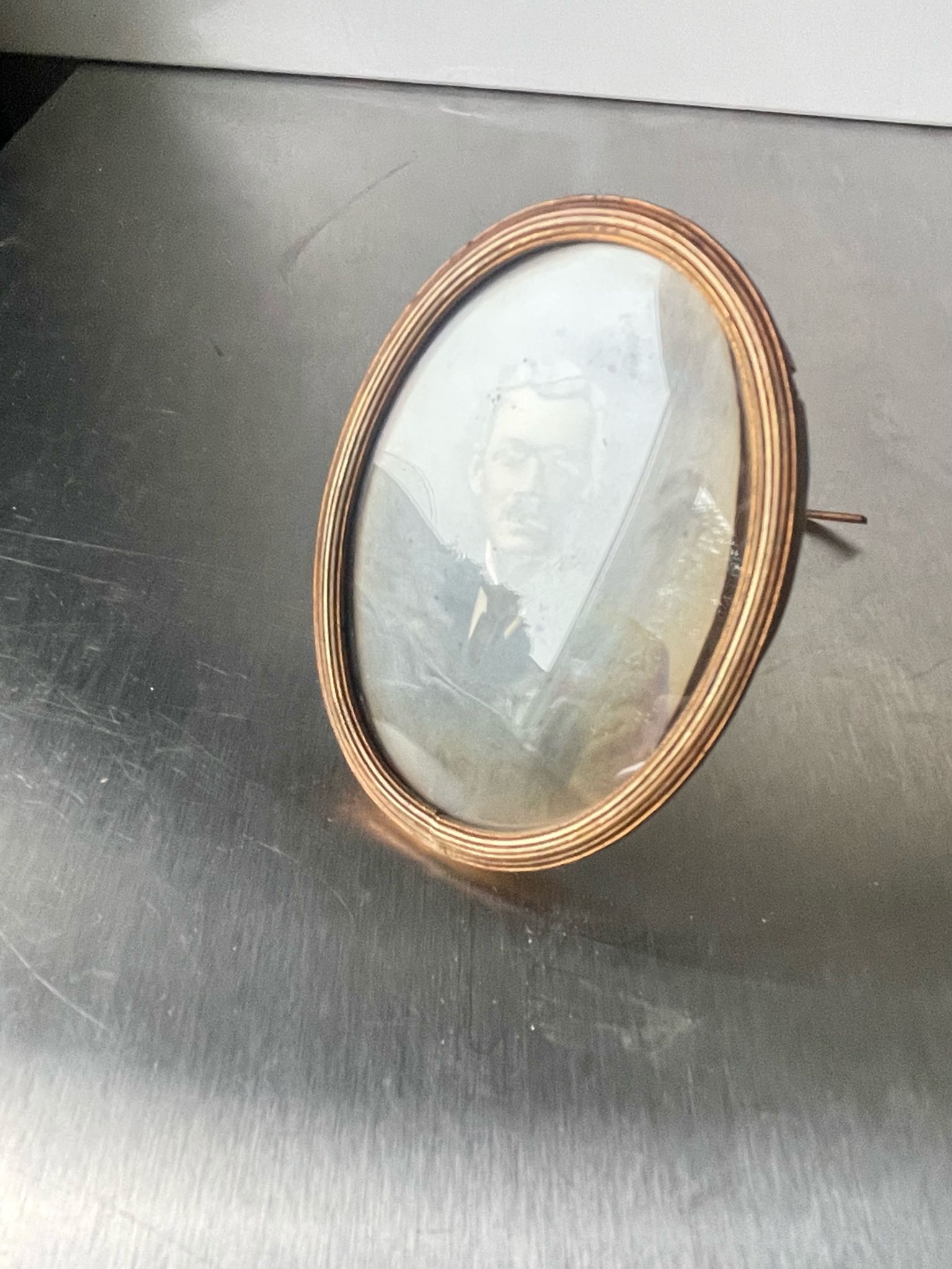 Metal gold colored oval picture frame brass