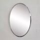 Oval mirror from the 1960s with a chrome frame.