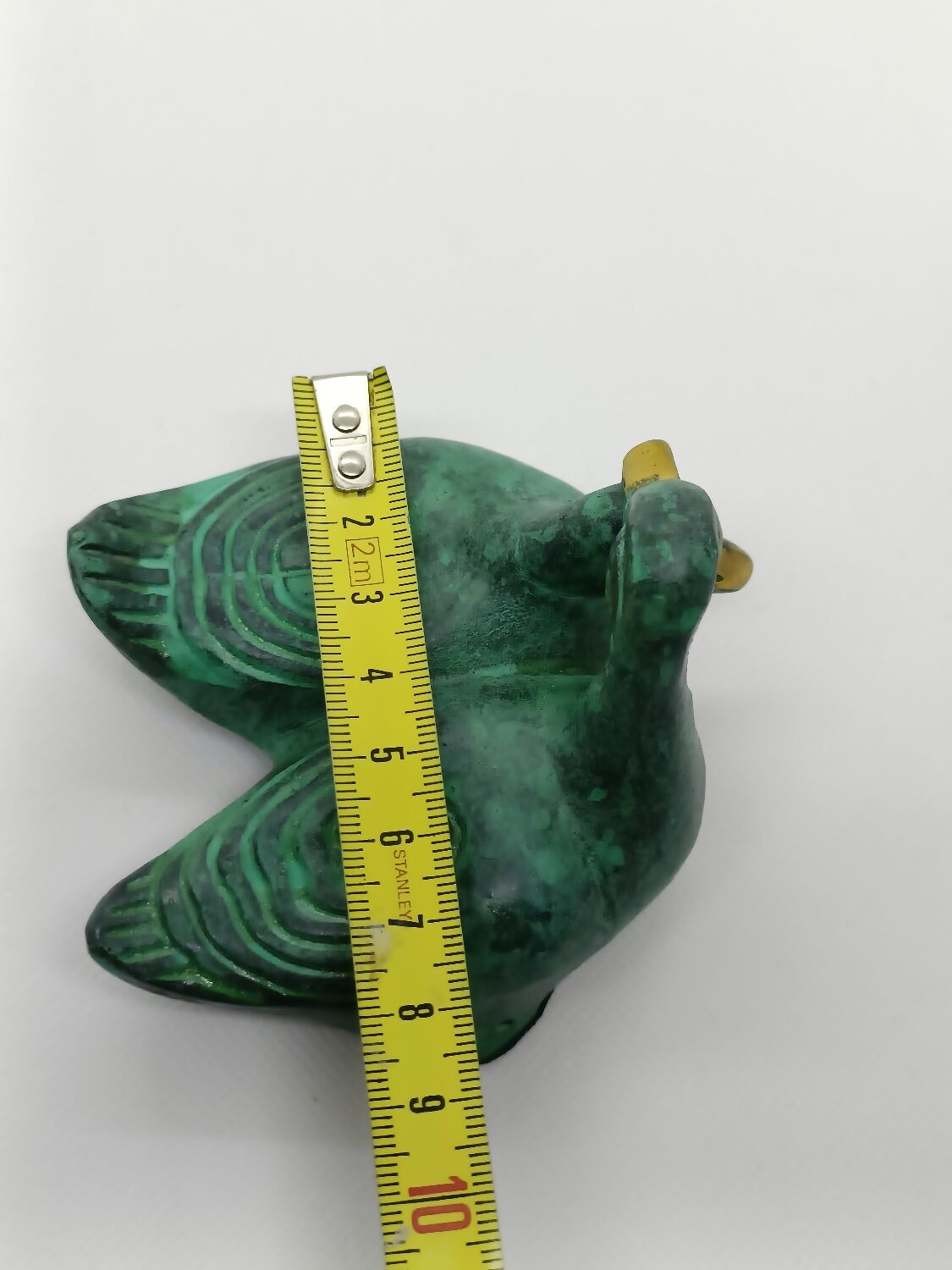 Two green and golden ducks in brass