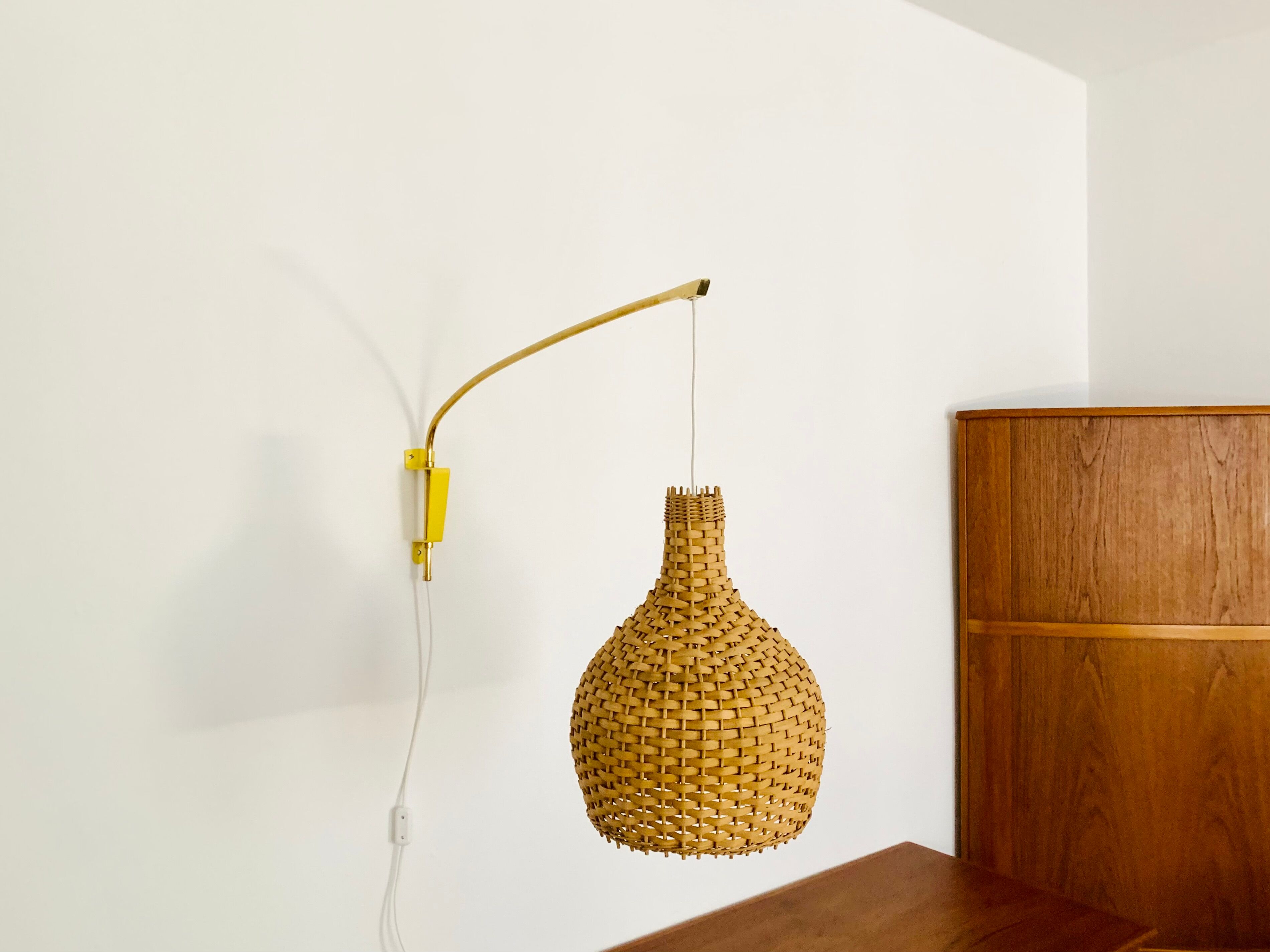 Adjustable Brass and Wicker Arc Sconce