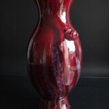 Beef blood vase decorated with taoties and flaming, China, 34cm, 19th century