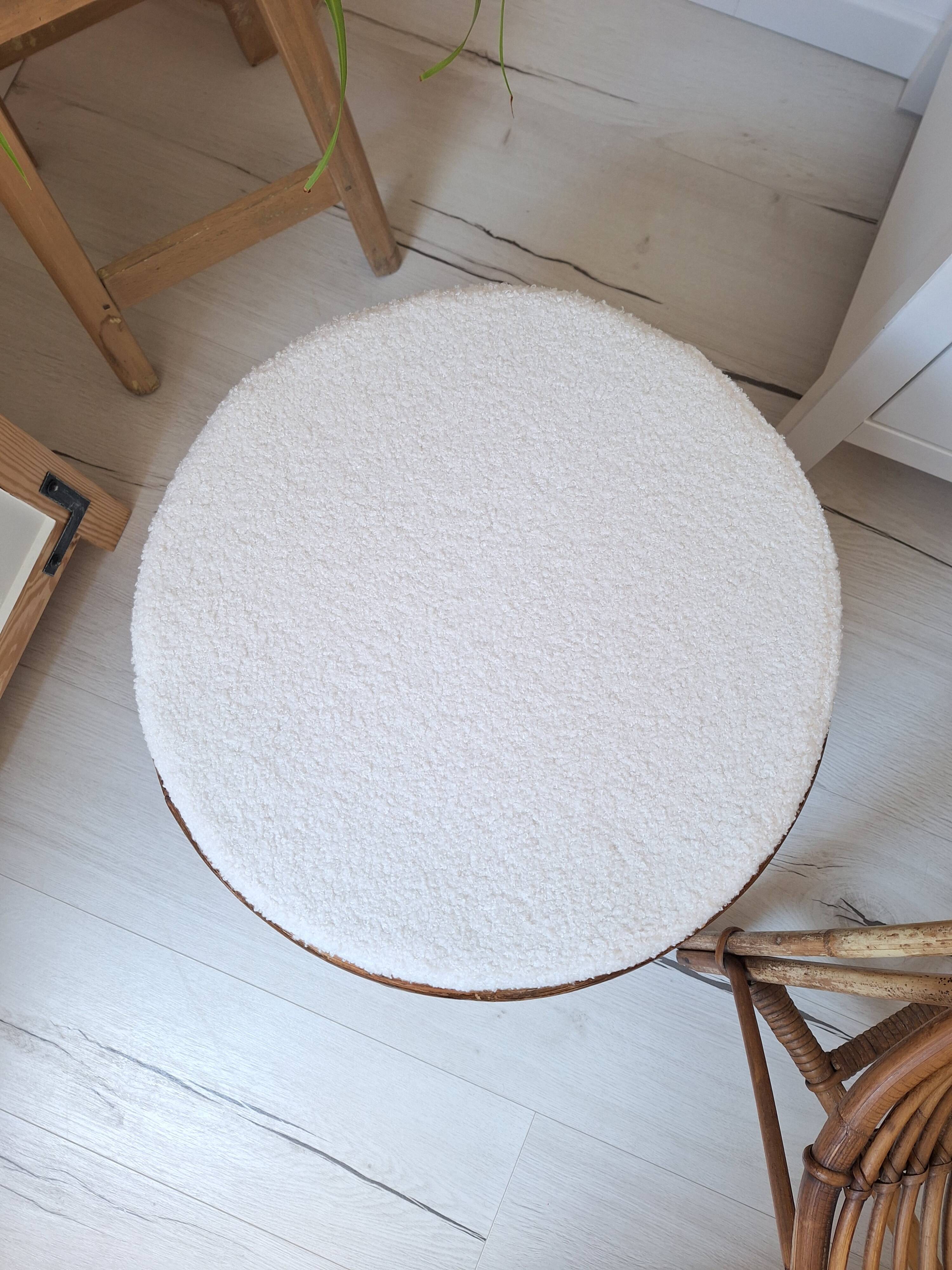 Rattan and boucle fabric pouf