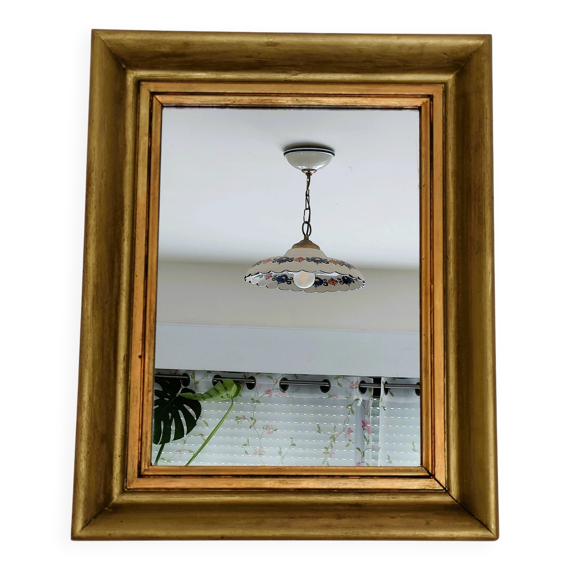 Antique mirror in gilded and copper wood