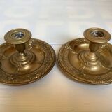 Pair of brass cellar rat candlesticks mascarons
