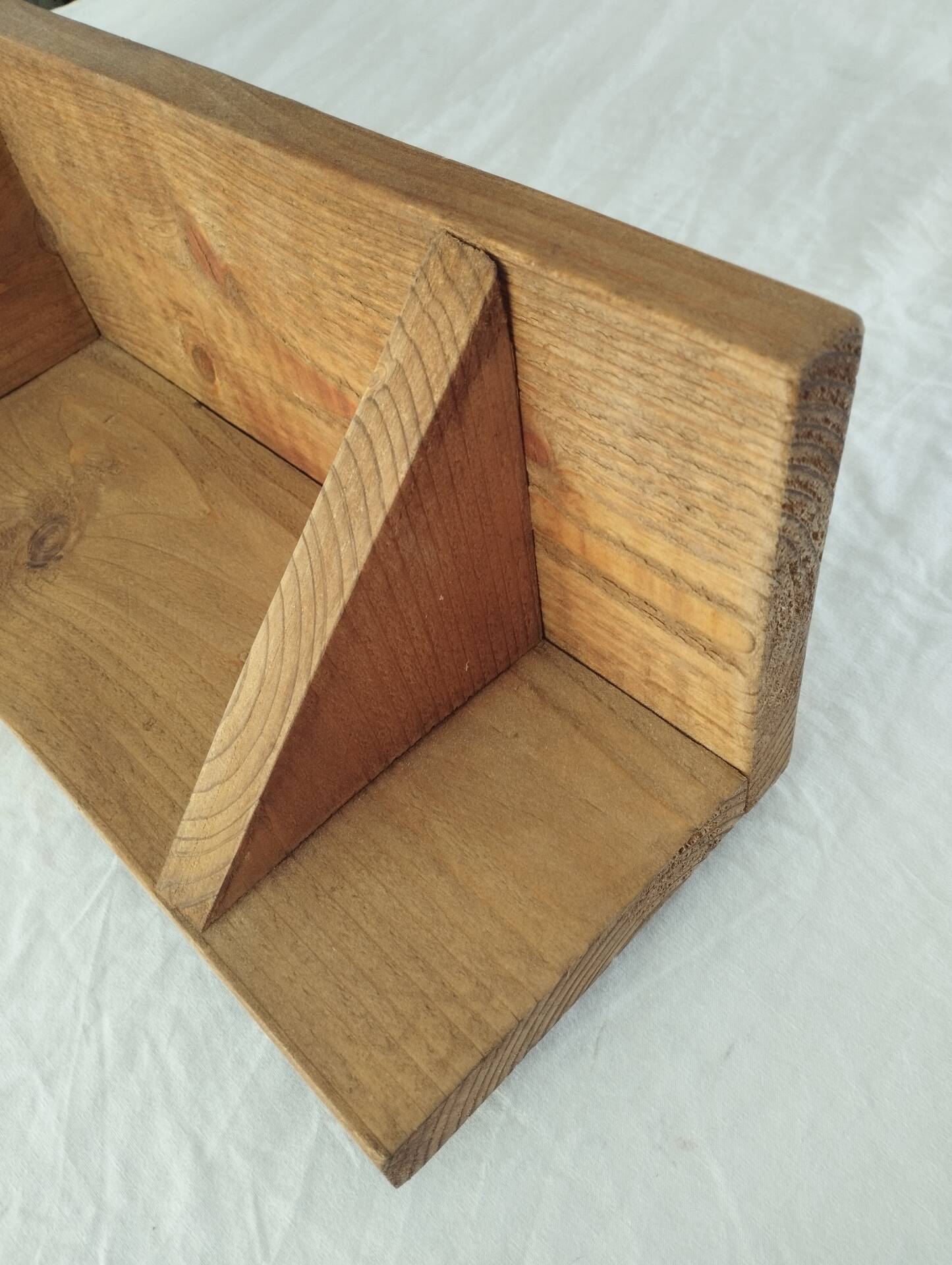 Handcrafted wall shelf in solid fir.