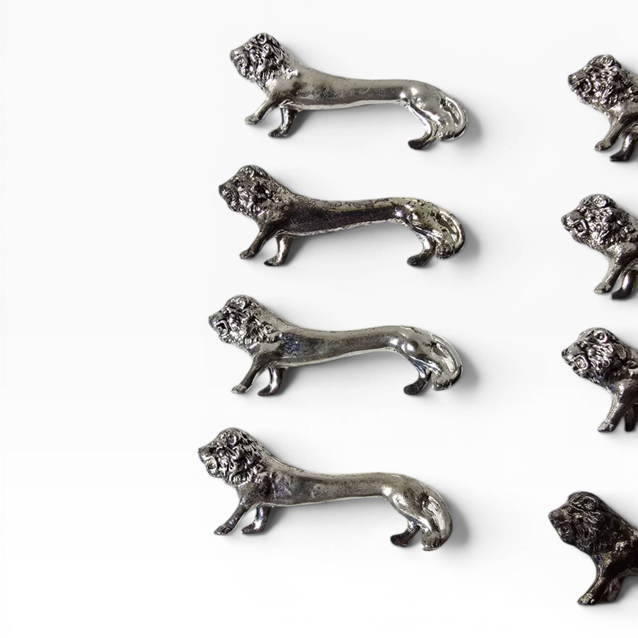 Series of antique knife rests in the shape of a lion, silver-plated metal.