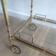 Brass rolling table from the Baguès house.