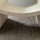 Table basse vintage en travertin et verre biseauté