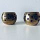 Pair of brass and glass tealight holders