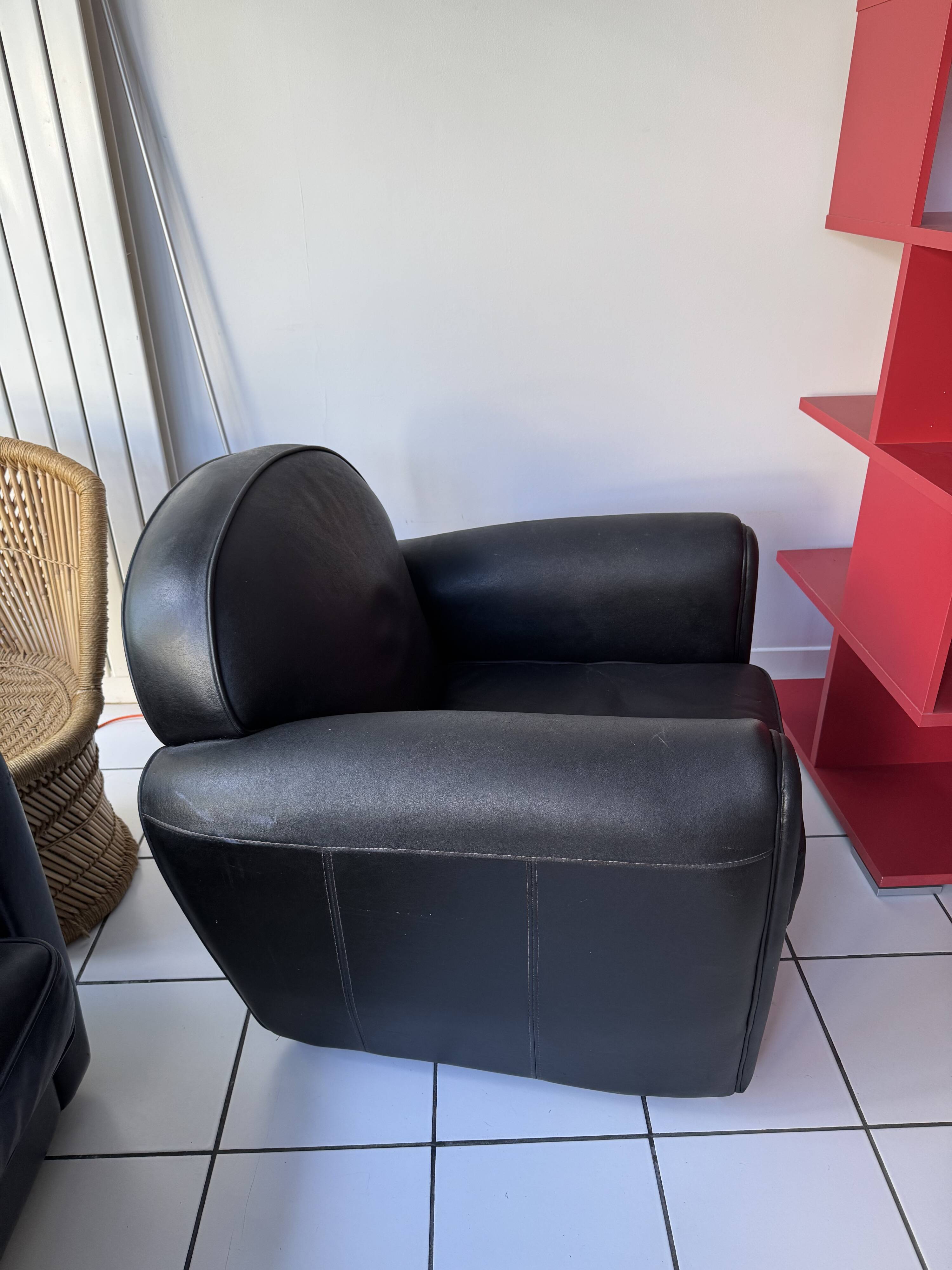 Matching black leather armchair – comfort and elegance