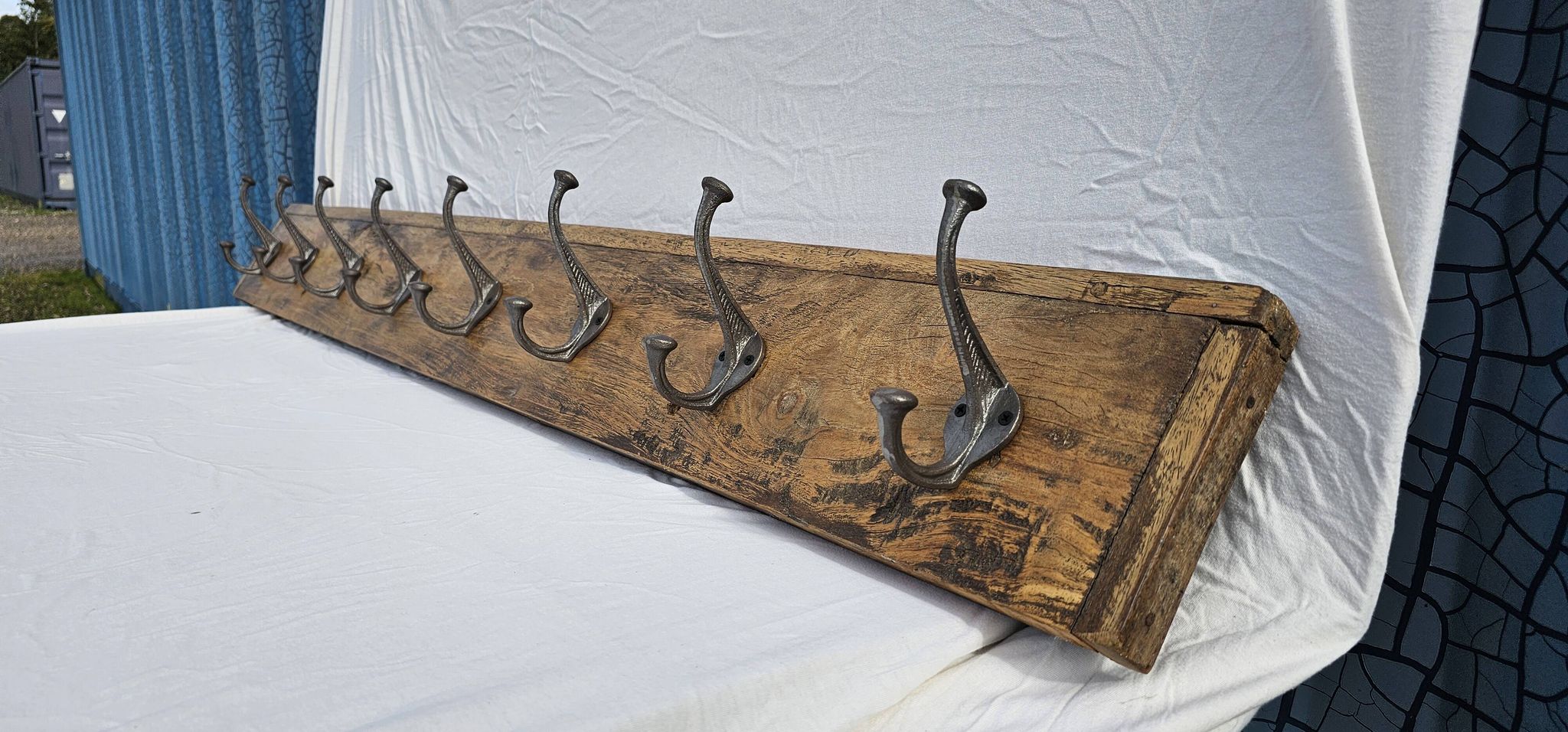 Teak coat rack with 8 double cast iron hooks