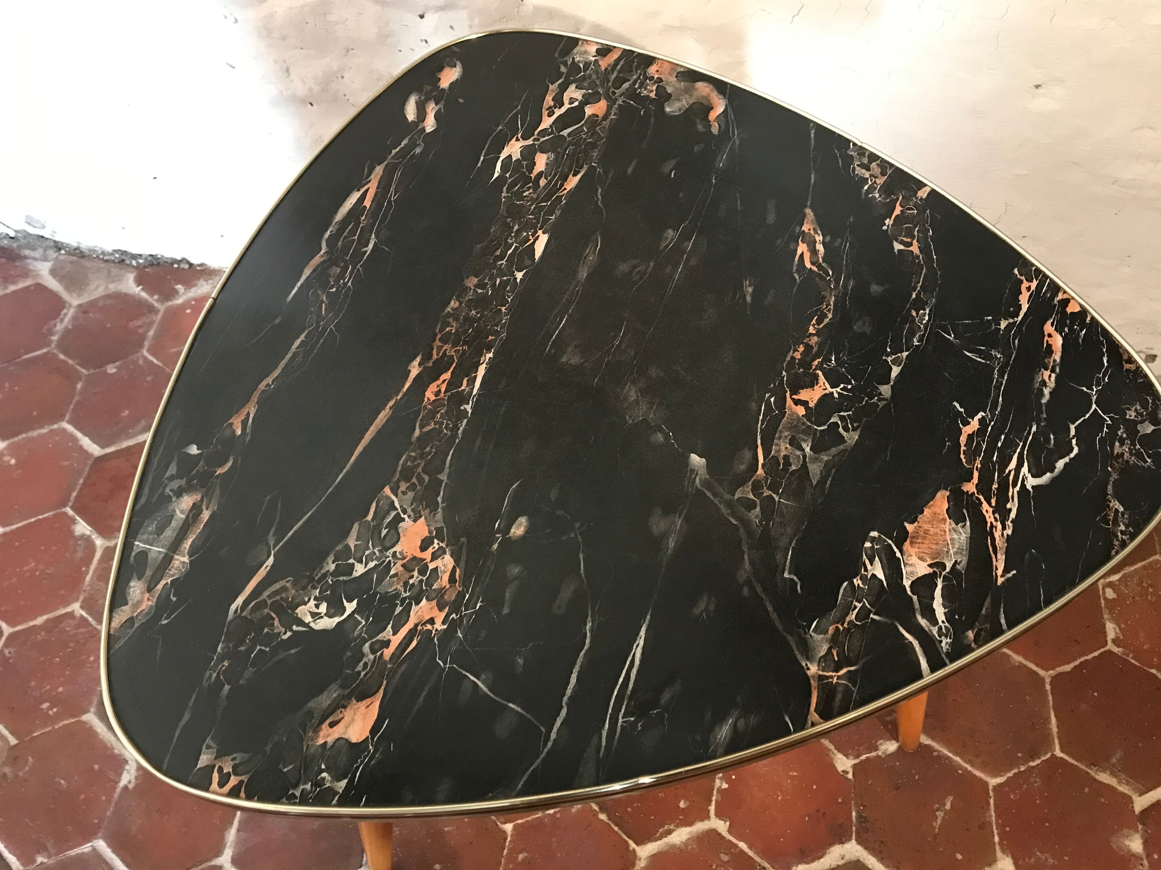 Free-form tripod coffee table