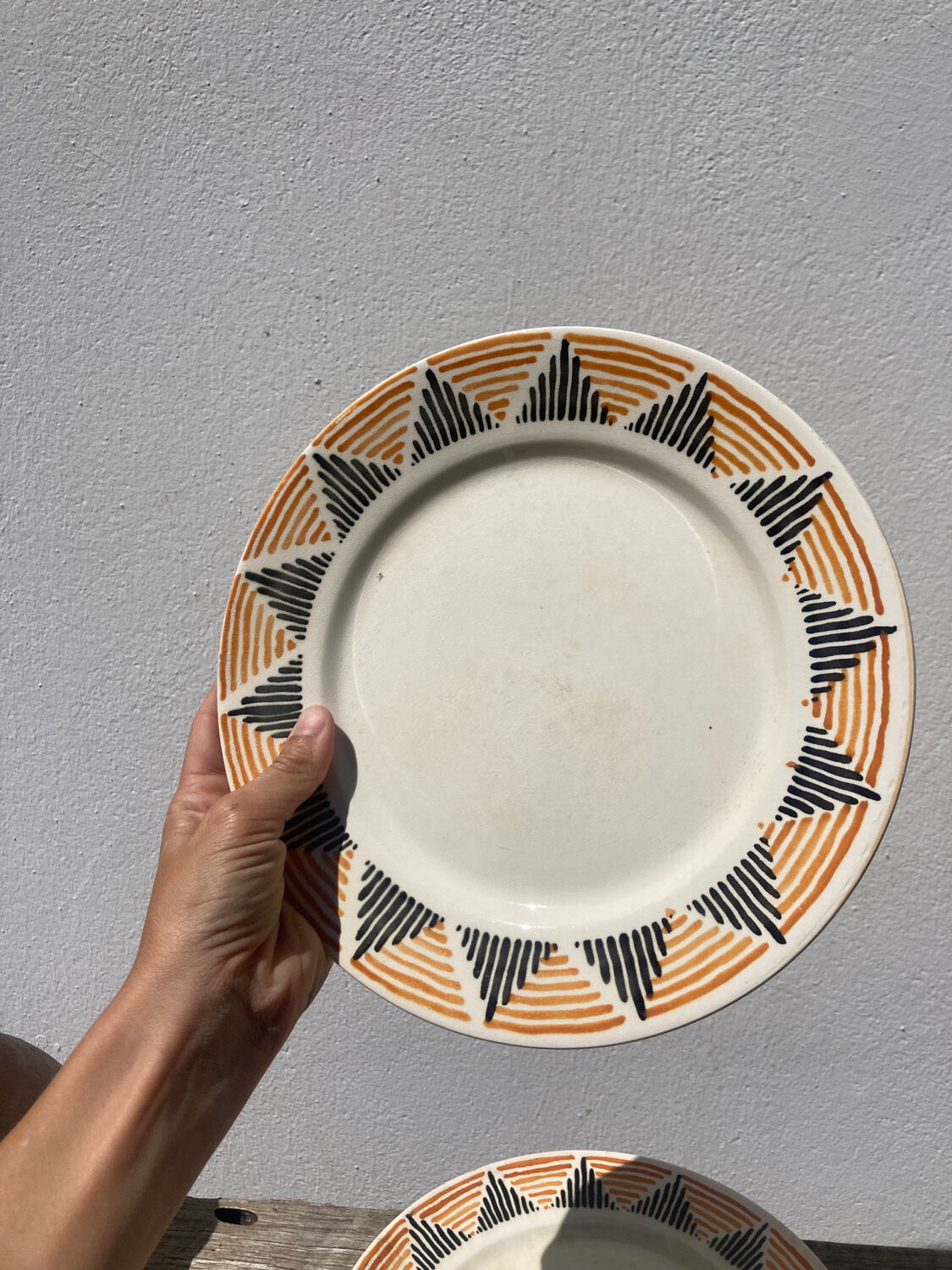 12 flat plates in yellow earthenware Badonviller