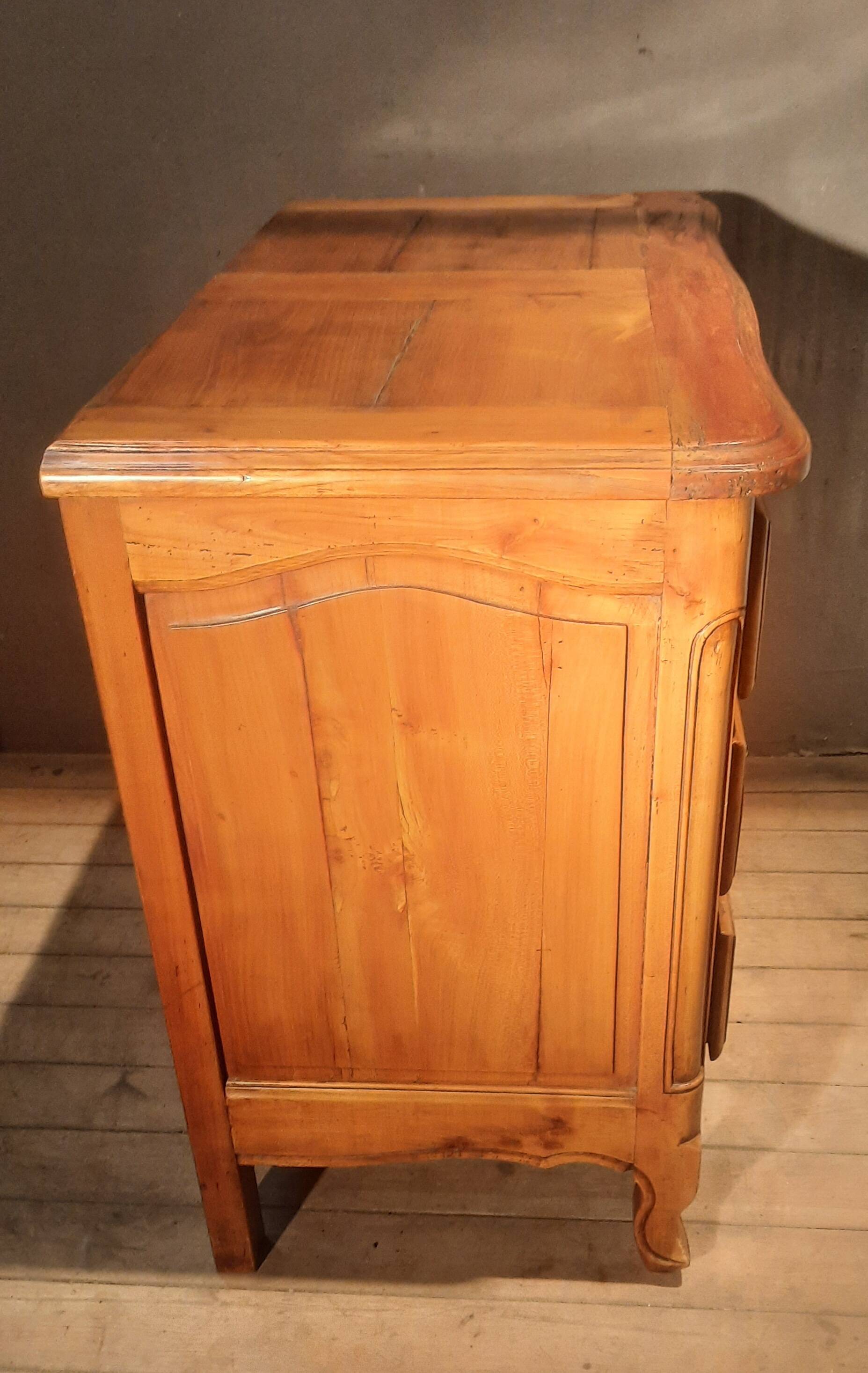 Louis XIV style commode in solid cherry wood.