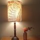 Aged metal table lamp, botanical shade