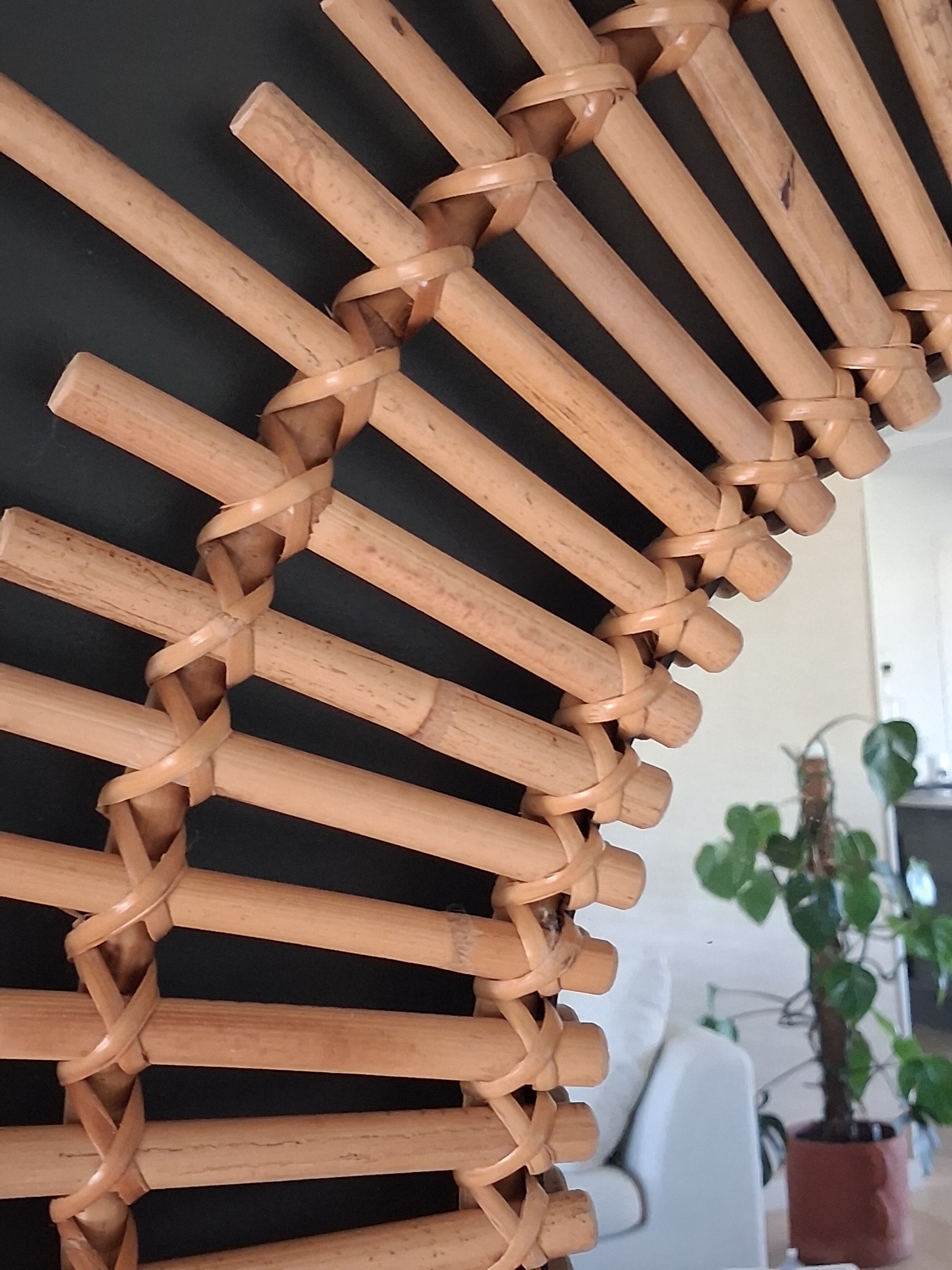Very large sun mirror in rattan.