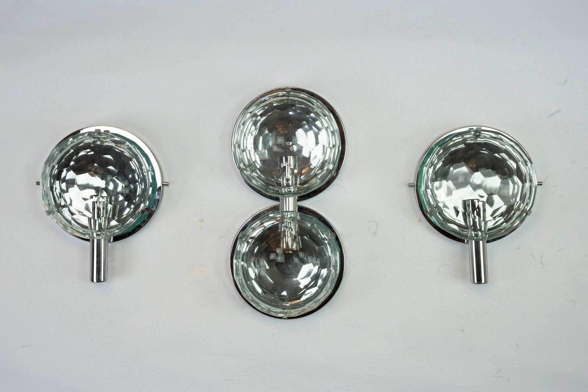 Set of three Cristal Art sconces in chrome and cut glass. Italy 1970s