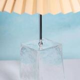 Minimalist glass table lamp from the 80s with a pleated shade.