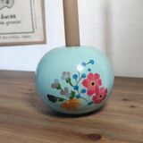 Floral candle holder in enamelled metal