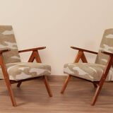 Pair of vintage lounge chairs in brown jacquard fabric and wood.