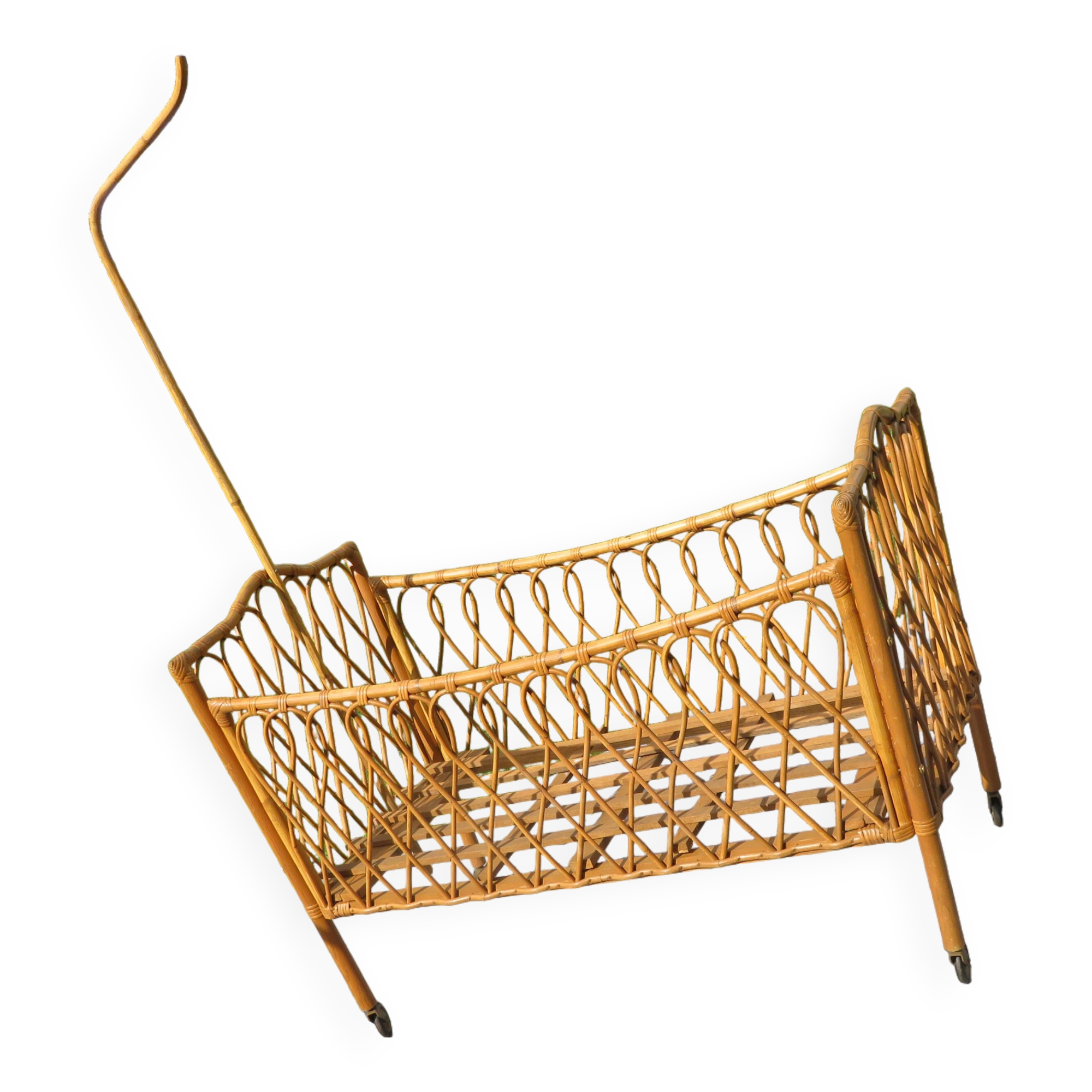 antique rattan children's bed with arrow