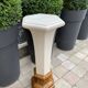 Column wears vintage plant