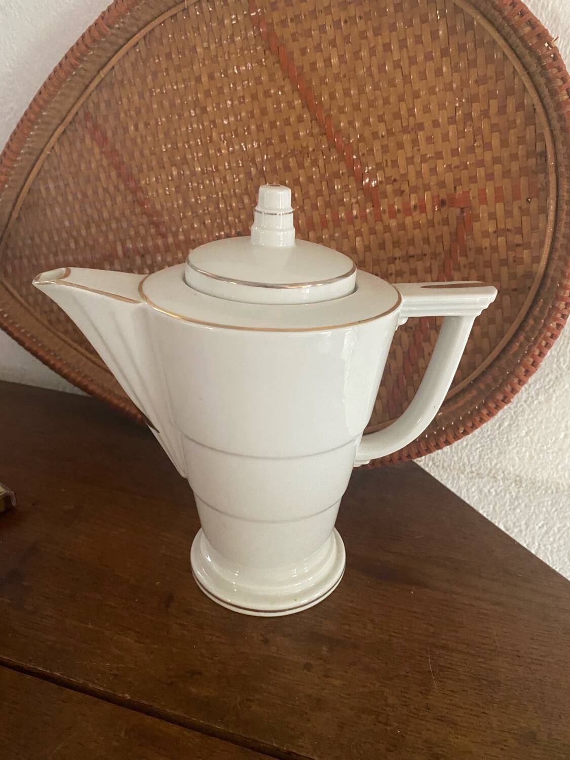 White and gold porcelain coffee pot in art deco style.